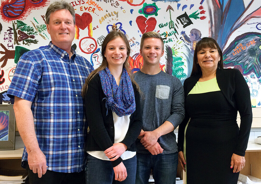 Dr. David Long, left, and Bernadette Iahtail, Executive Director of Creation Hope Society of Alberta, far right