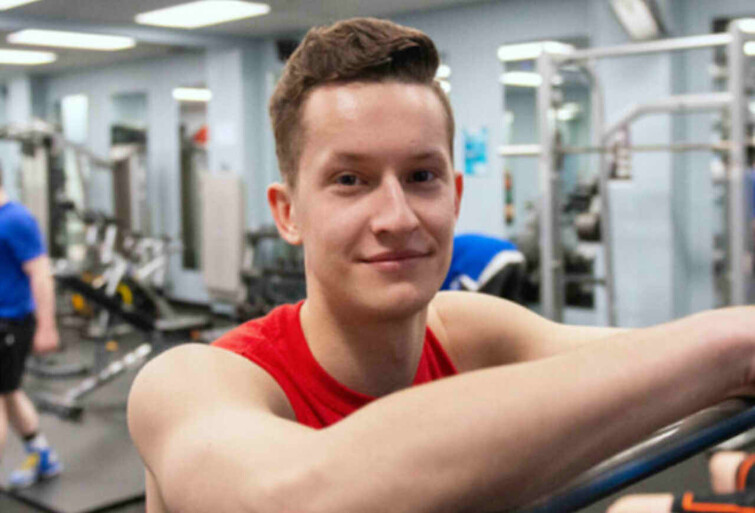 Male student in campus fitness centre